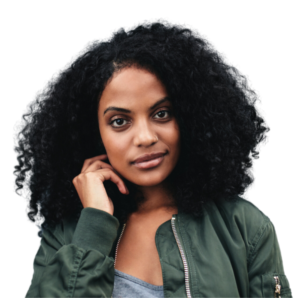 Portrait of a young African American woman with an afro smiling.