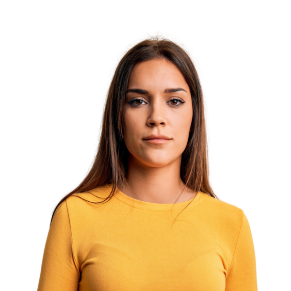 Portrait of a Hispanic woman in a yellow long sleeve sweater - Glad for free pregnancy services