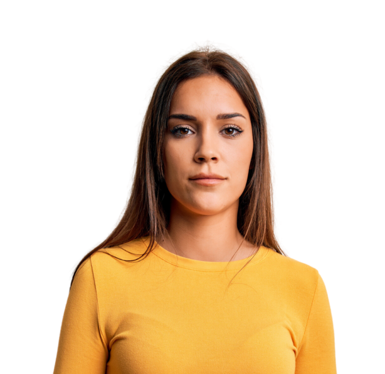 Portrait of a Hispanic woman in a yellow long sleeve sweater - Glad for free pregnancy services