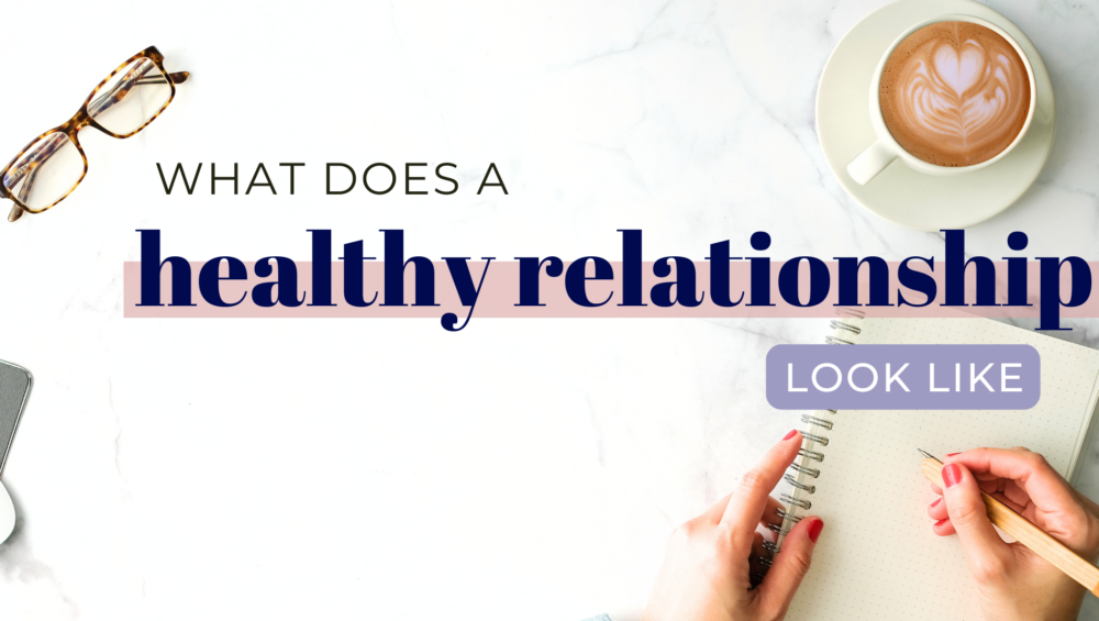 Notebook and coffee on a table with text asking, "What does a healthy relationship look like?"