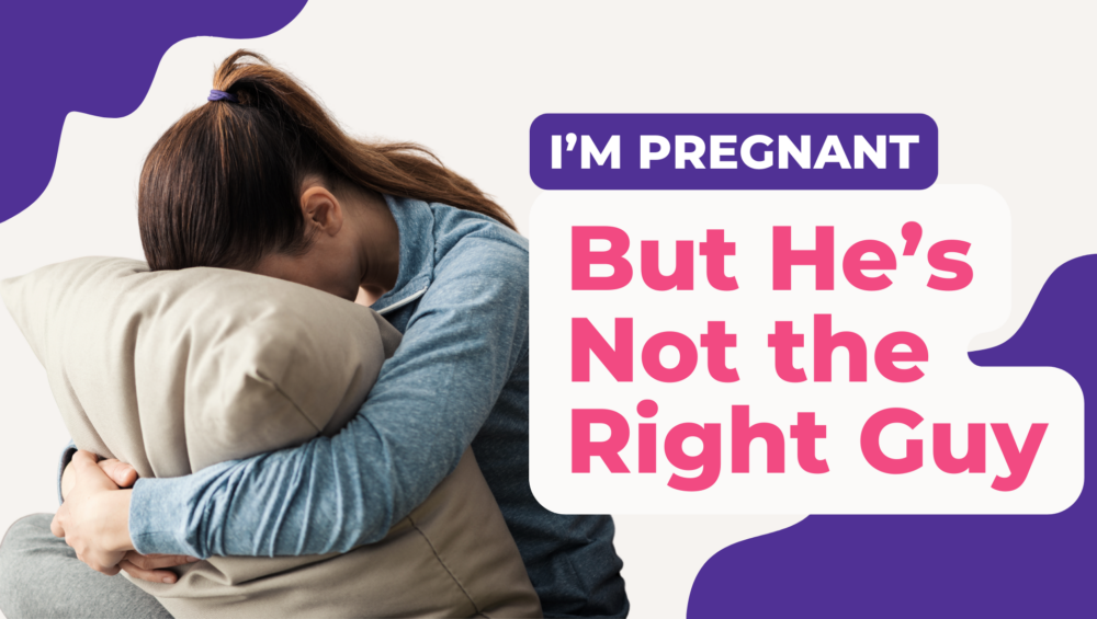 Young woman hugging a pillow and crying, with text that says “I’m pregnant, but he’s not the right guy” – unplanned pregnancy support image