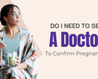 Black woman holding a phone and green smoothie, looking thoughtful — wondering if she needs to see a doctor to confirm pregnancy in Detroit or Southfield, Michigan.