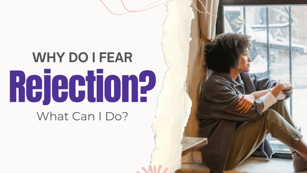 Young Black woman sitting by a window looking out with a concerned expression — struggling with fear of rejection during pregnancy in Detroit, MI.