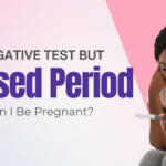 Concerned Black woman looking at a negative pregnancy test, wondering if she’s pregnant despite a missed period — seeking answers in Detroit, MI.
