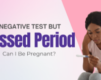 Concerned Black woman looking at a negative pregnancy test, wondering if she’s pregnant despite a missed period — seeking answers in Detroit, MI.