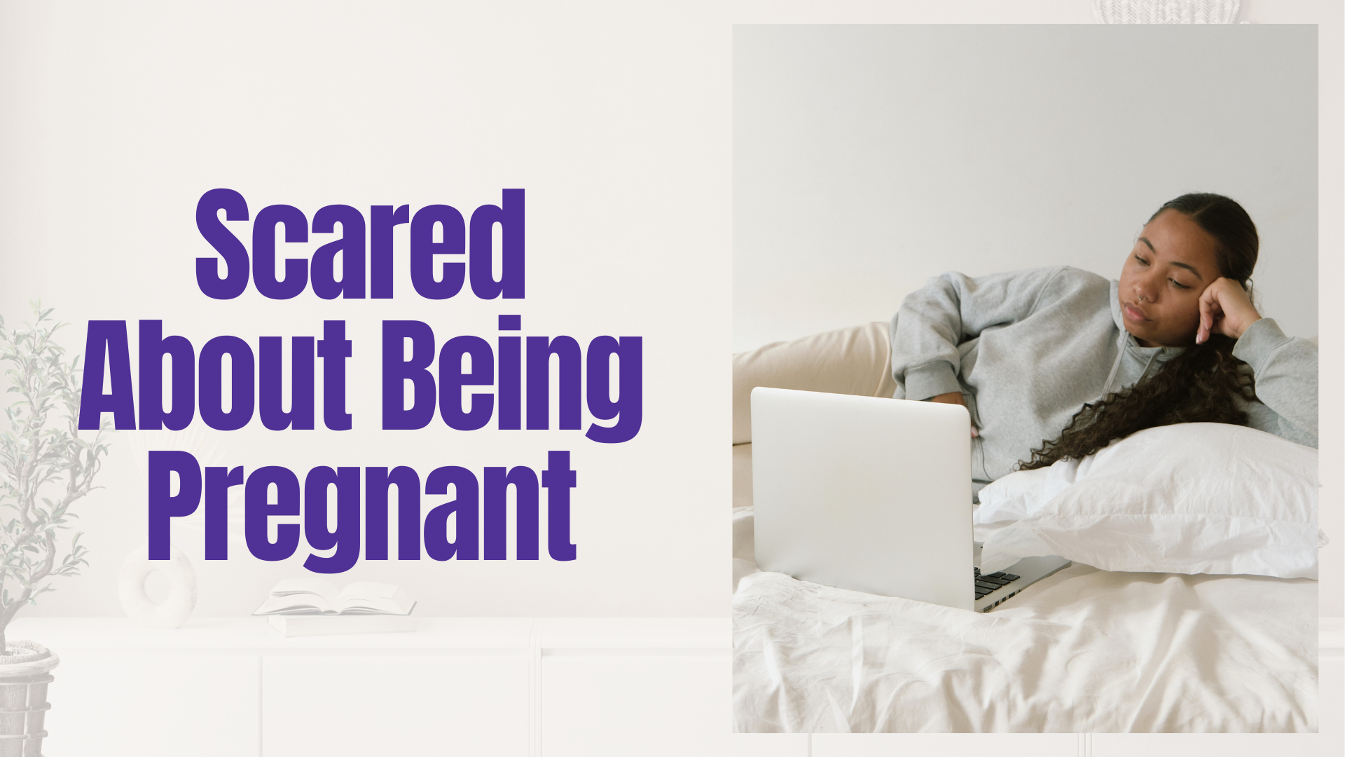 Worried young woman laying in bed looking at laptop, researching pregnancy options in Detroit and Southfield Michigan