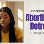 Woman in Detroit exploring options and support when considering abortion.