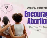 young woman spending time with two friends, arms draped around one another.